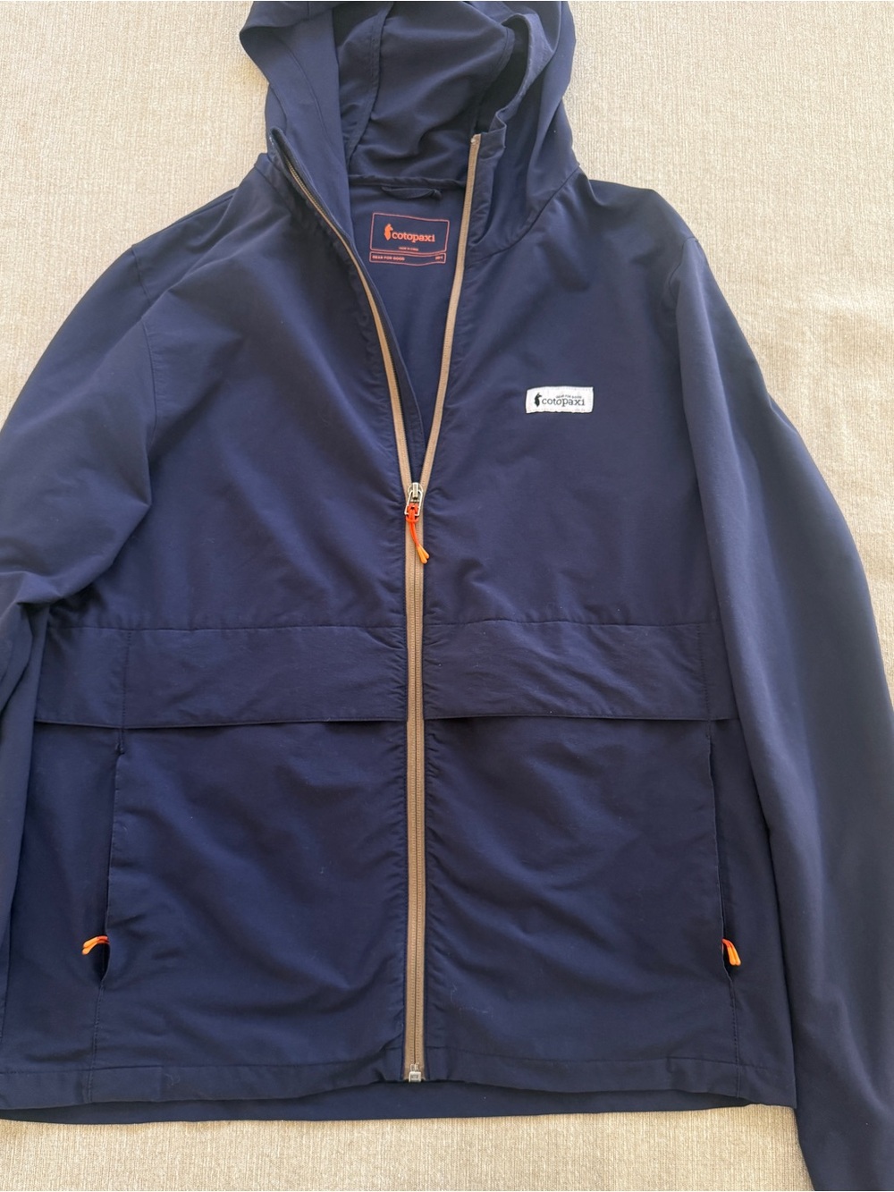 cotopaxi Navy Hooded Windbreaker with Orange Accents